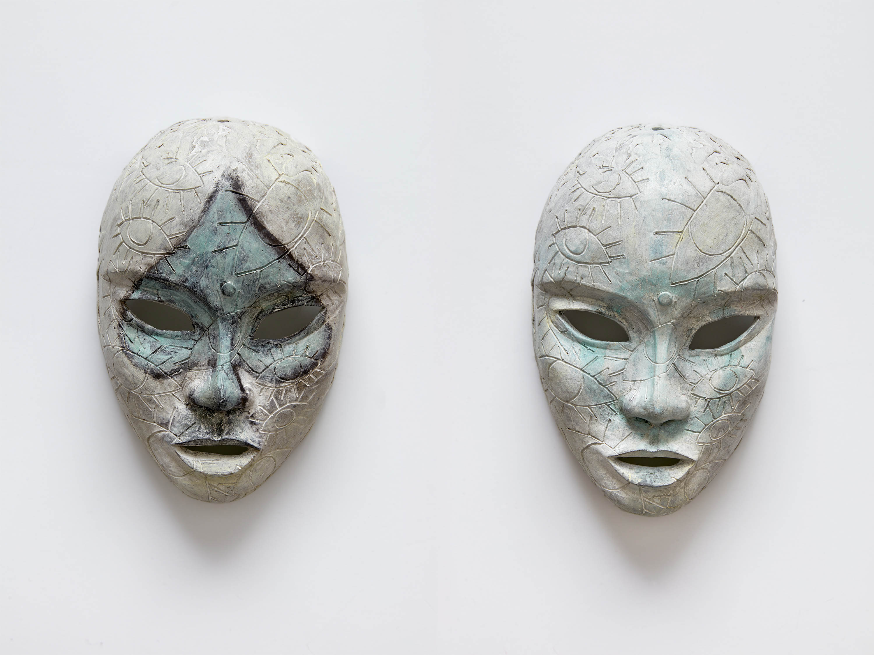 Chiki, <i>Prop Masks 2</i>, 2025. Bronze cast, titanium white patina, <br> each mask 9 7/8 x 5 7/8 x 4 in (25 x 15 x 10 cm)